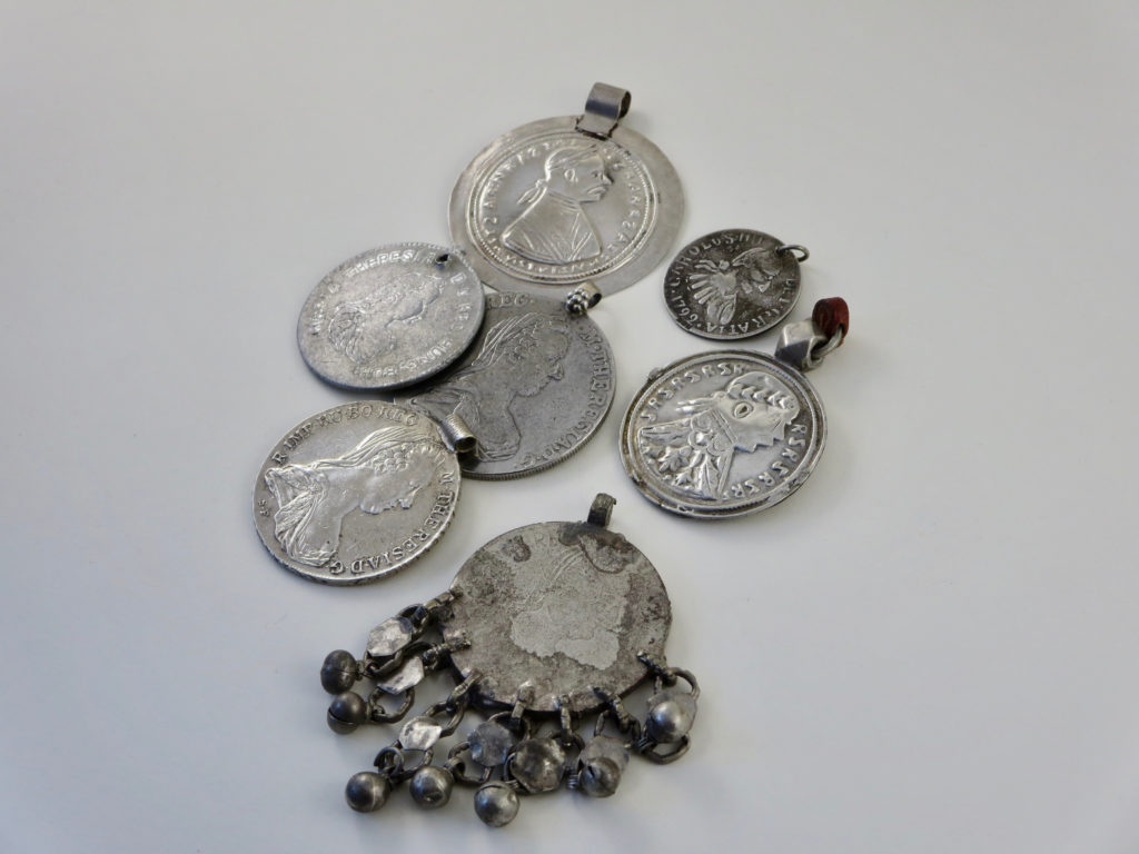 Imitation coins used as pendants in jewellery
