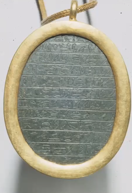 The back of the heart scarab pendant inscribed with a verse from Chapter 30 of The Book of the Dead