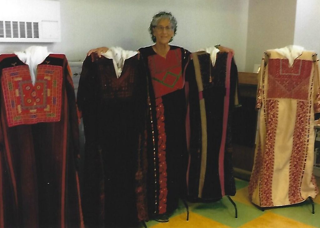 Betsy Gilon with her collection of dresses.